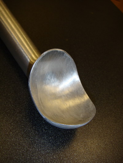A sharpened ice cream scoop.